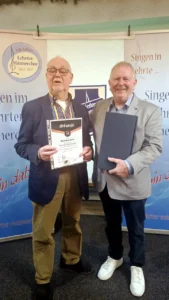 Ehrenurkunde und Ehrenzeichen in Silber für 40 Jahre (Reinhard Köln